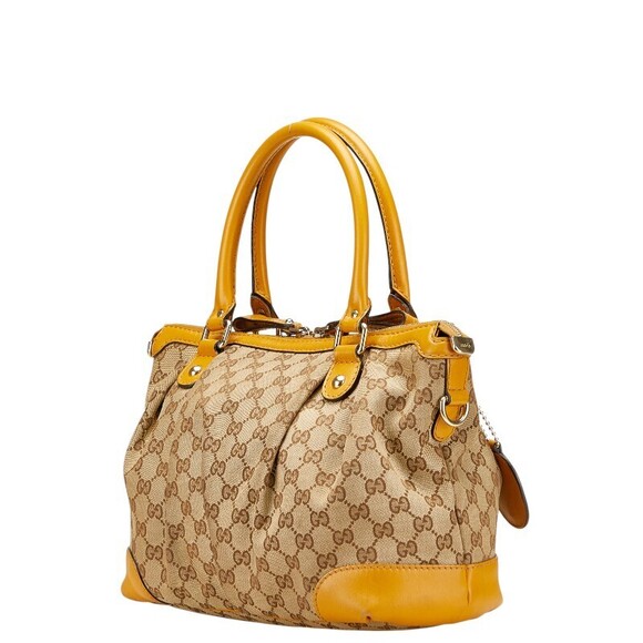 Gucci Handbags - Gucci Beige Sukey Handbag Yellow Tan Canvas Shoulder Leather GG Bag